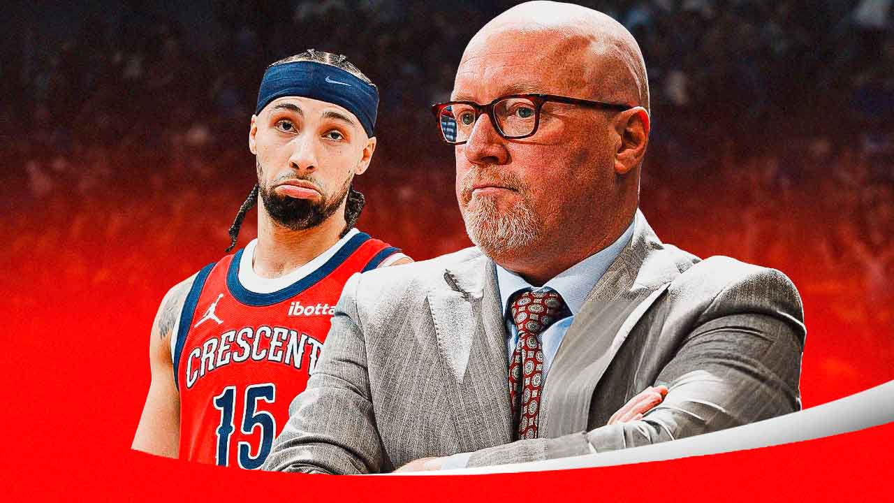 Jose Alvarado with Pelicans GM looking.