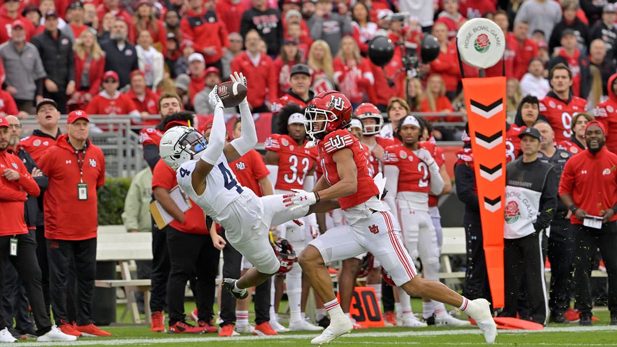 Penn State Nittany Lions cornerback Kalen King (4) intercepts a pass intended for Utah Utes wide receiver Devaughn Vele (17) during the first half at Rose Bowl.