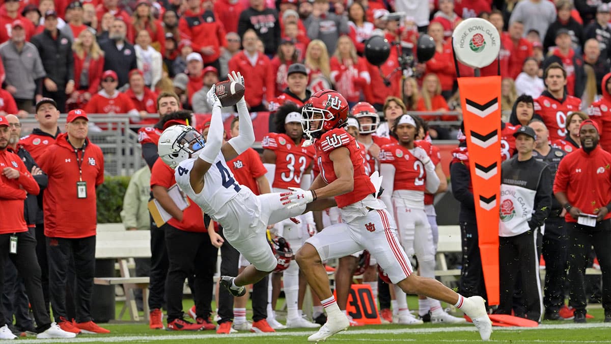 Penn State Nittany Lions cornerback Kalen King (4) intercepts a pass intended for Utah Utes wide receiver Devaughn Vele (17) during the first half at Rose Bowl. 