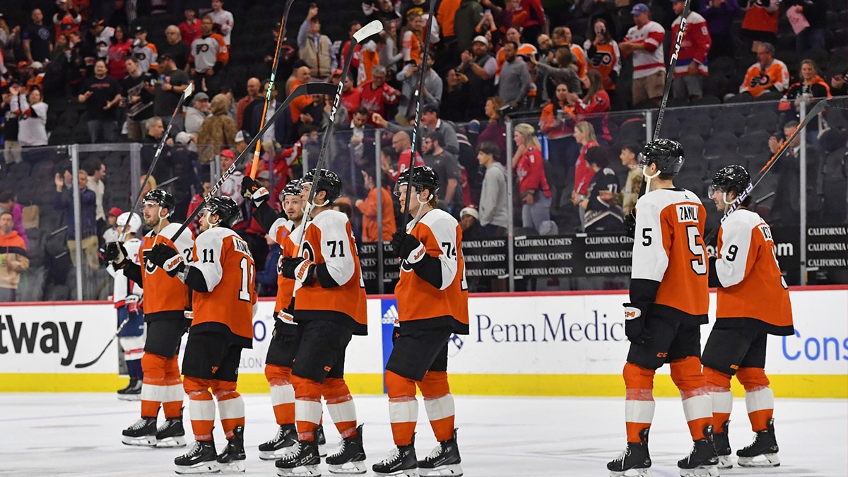 Philadelphia Flyers right wing Travis Konecny (11), right wing Tyson Foerster (71) and right wing Owen Tippett (74) acknowledge the fans after loss to the Washington Capitals during the second period at Wells Fargo Center.