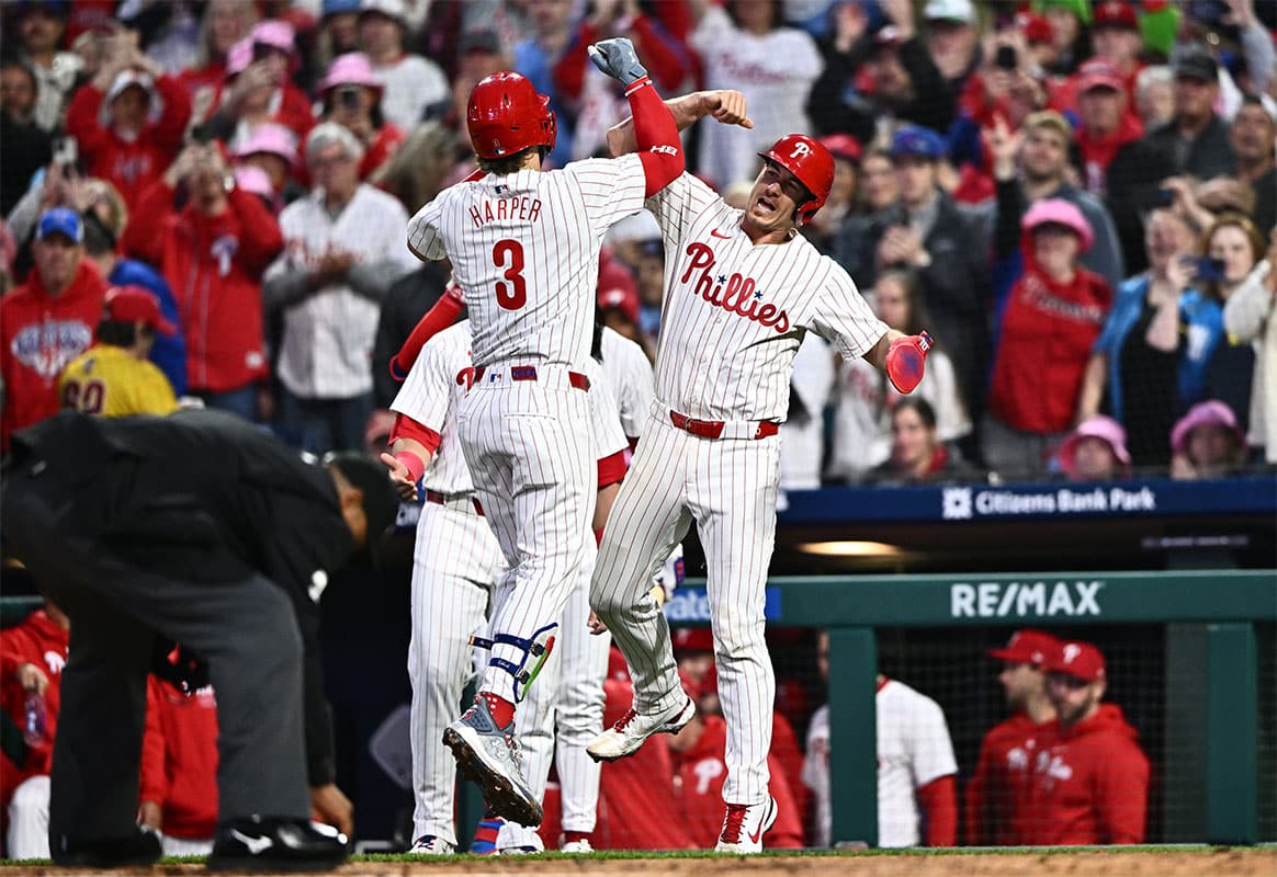 Philadelphia Phillies first baseman Bryce Harper (3) celebrates with catcher J.T. Realmuto (10) after hitting a three-run home run against the San Francisco Giants in the third inning at Citizens Bank Park. 
