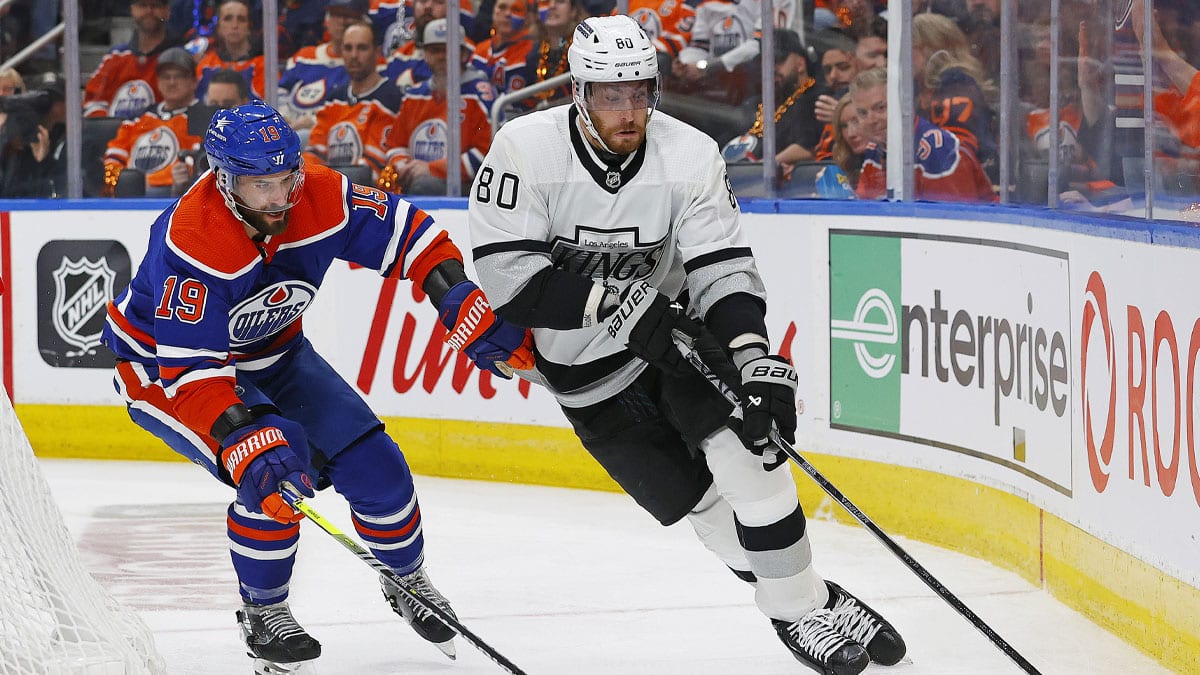 Los Angeles Kings forward Pierre-Luc Dubois (80) protects the puck from Edmonton Oilers forward Adam Henrique (19) during the second period in game five of the first round of the 2024 Stanley Cup Playoffs at Rogers Place.