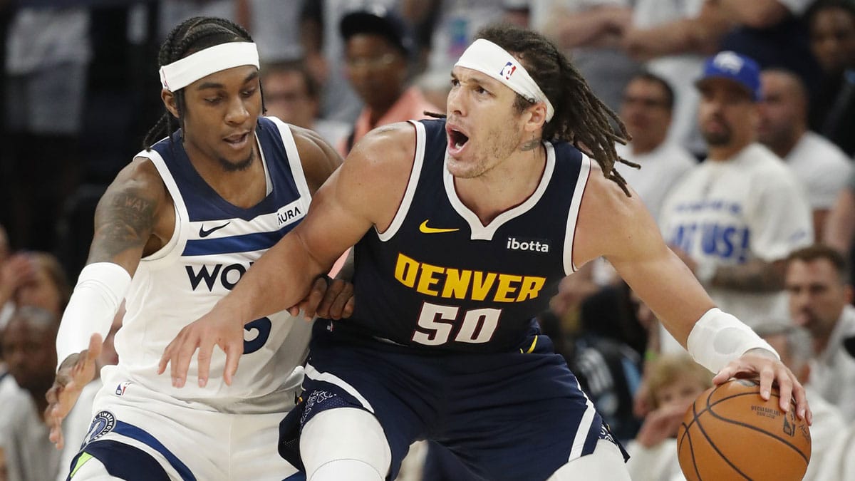 Denver Nuggets forward Aaron Gordon (50) and Minnesota Timberwolves forward Jaden McDaniels (3)