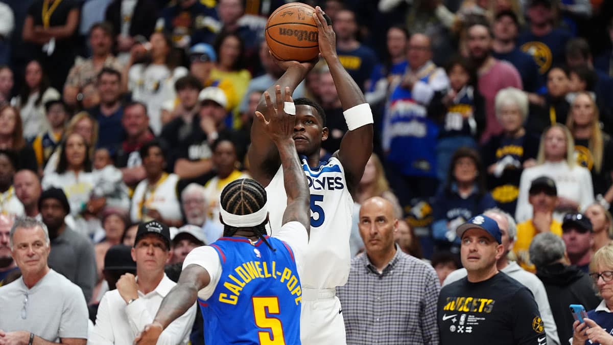 Minnesota Timberwolves guard Anthony Edwards (5) shoots over Denver Nuggets guard Kentavious Caldwell-Pope (5)