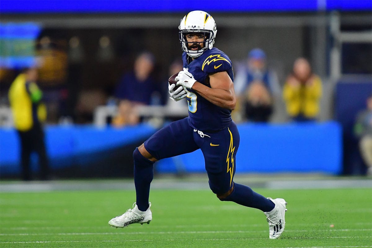 Los Angeles Chargers wide receiver Jalen Guyton (15) runs the ball against the Baltimore Ravens during the second half at SoFi Stadium.