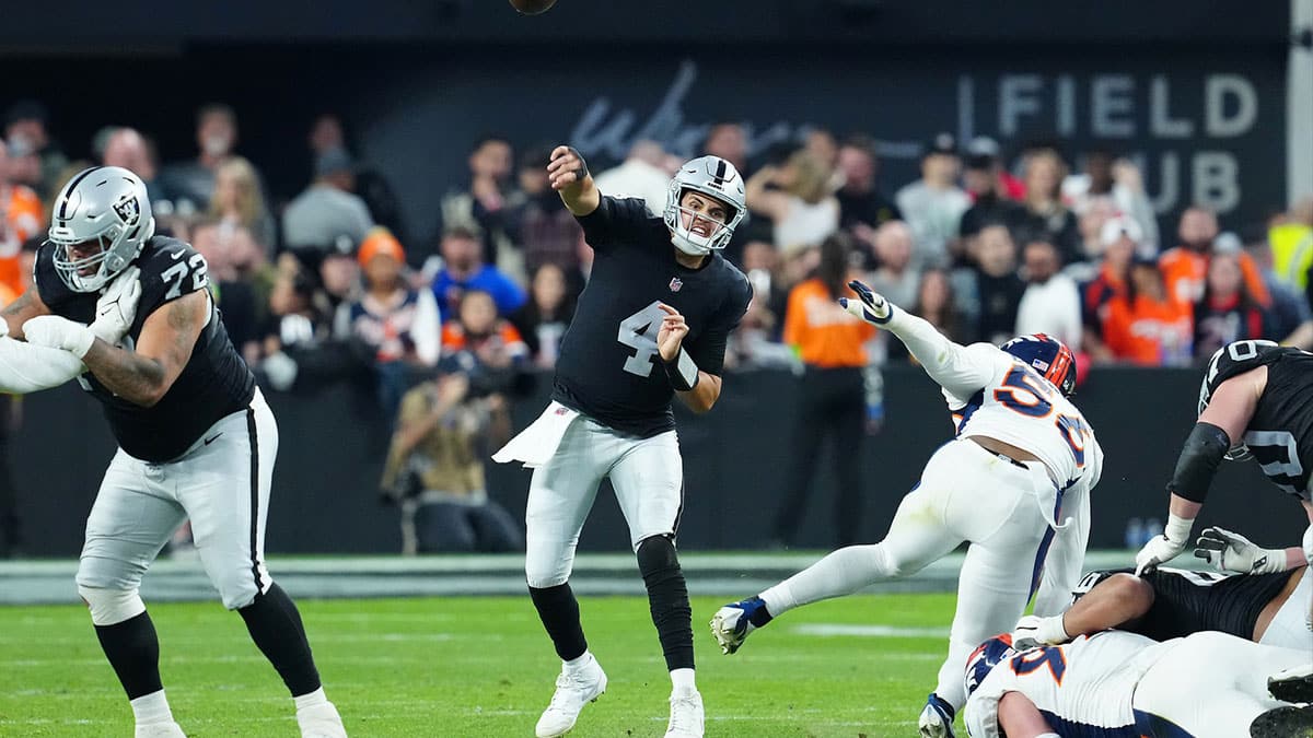 Las Vegas Raiders quarterback Aidan O'Connell (4) throws against the Denver Broncos during the fourth quarter at Allegiant Stadium. 