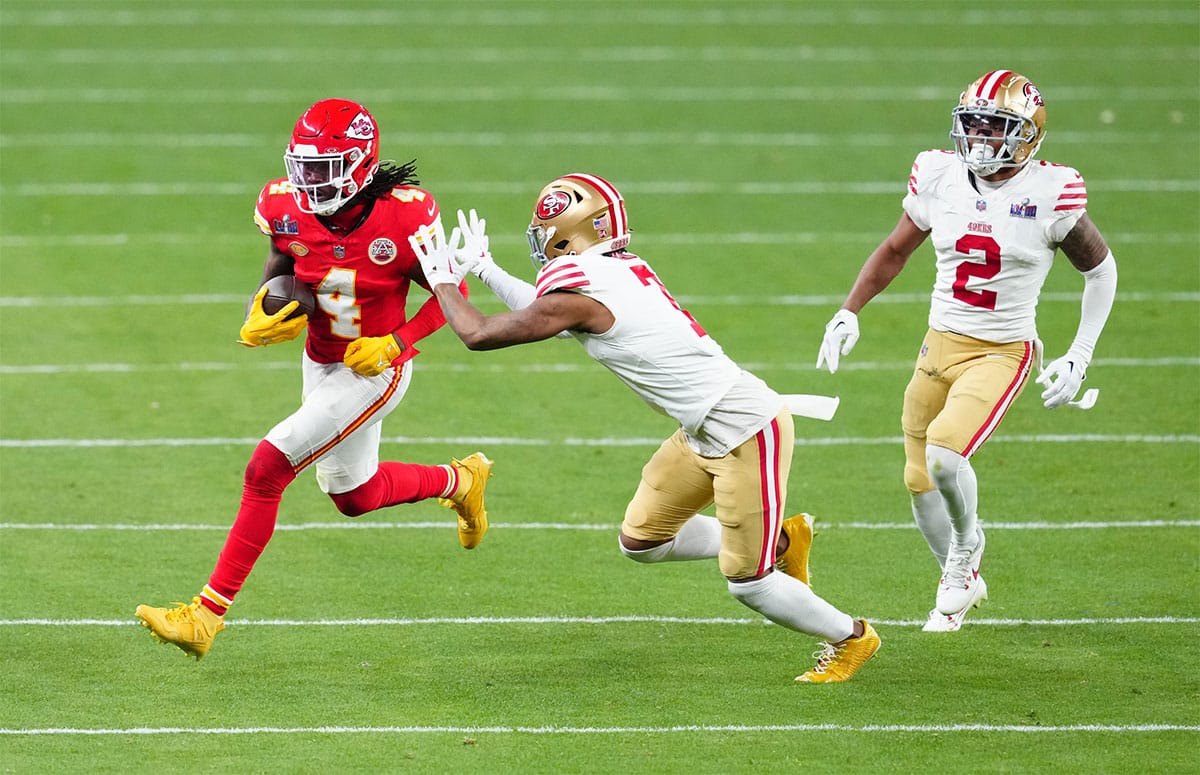 Feb 11, 2024; Paradise, Nevada, USA; Kansas City Chiefs wide receiver Rashee Rice (4) catches a pass against San Francisco 49ers cornerback Charvarius Ward (7) during overtime in Super Bowl LVIII at Allegiant Stadium.