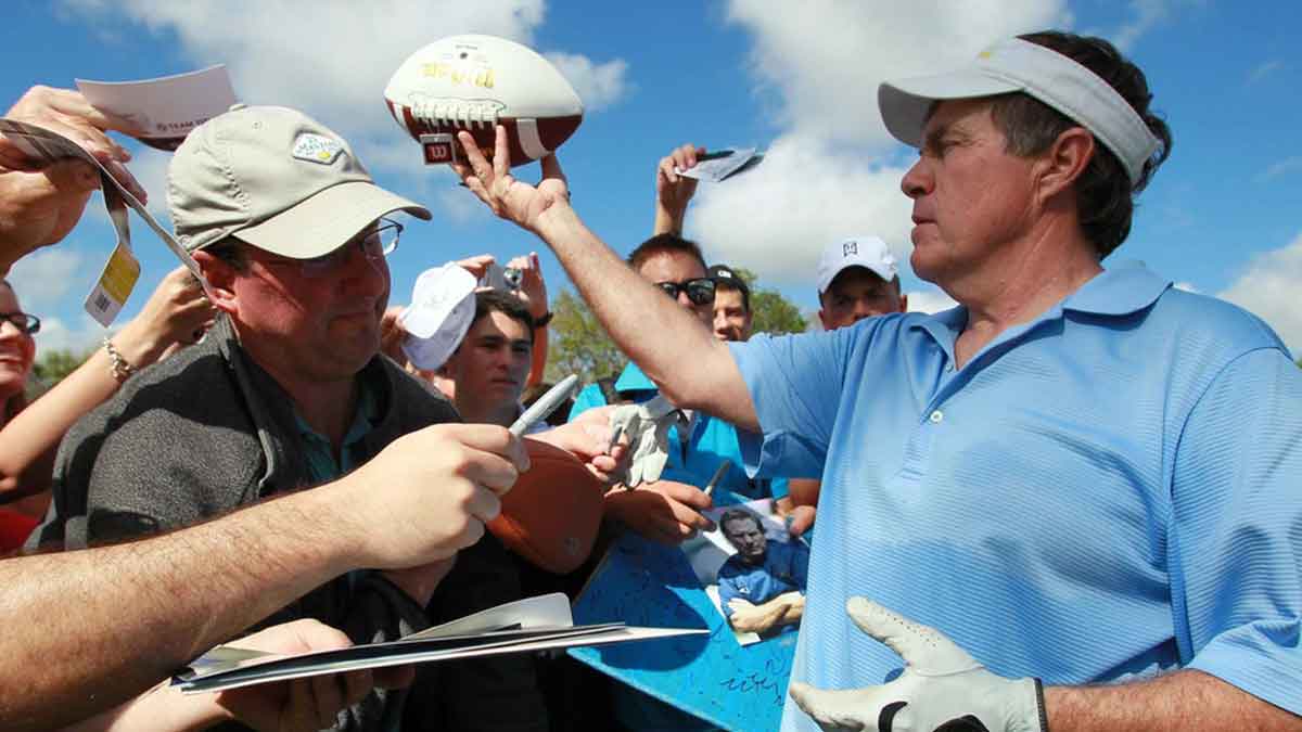 New England Patriots head coach Bill Belichick signs autographs during his pro-am appearance with golfing great Greg Norman, golf star Lexi Thompson, former NFL quarterback and TV commentator Joe Theismann and musician Kenny G at the Honda Classic in 2012.