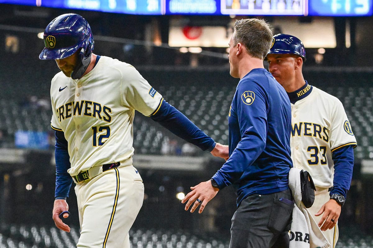Milwaukee Brewers first baseman Rhys Hoskins (12) leaves the game with an injury in the second inning against the Pittsburgh Pirates at American Family Field. 