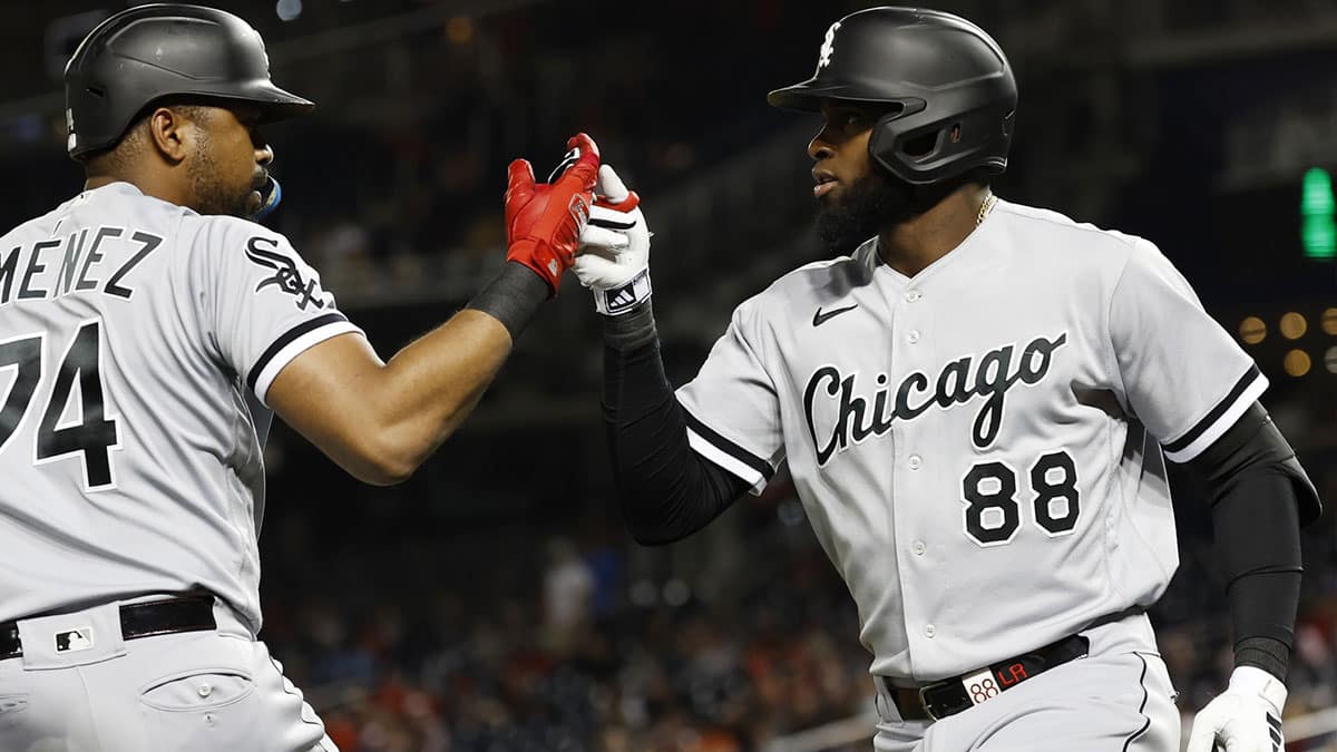 Chicago White Sox center fielder Luis Robert Jr. (88) celebrates with White Sox designated hitter Eloy Jimenez (74) after hitting a home run against the Washington Nationals during the fourth inning at Nationals Park.