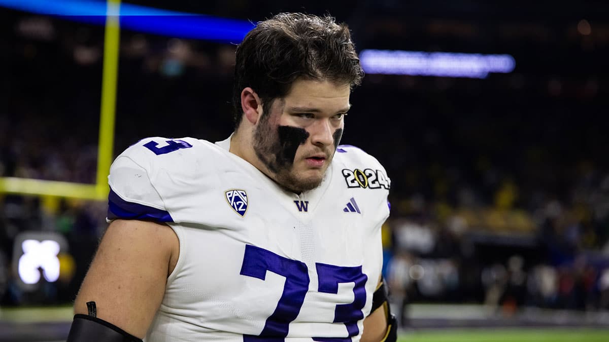 Washington Huskies offensive lineman Roger Rosengarten 73  against the Michigan Wolverines during the 2024 College Football Playoff national championship game at NRG Stadium