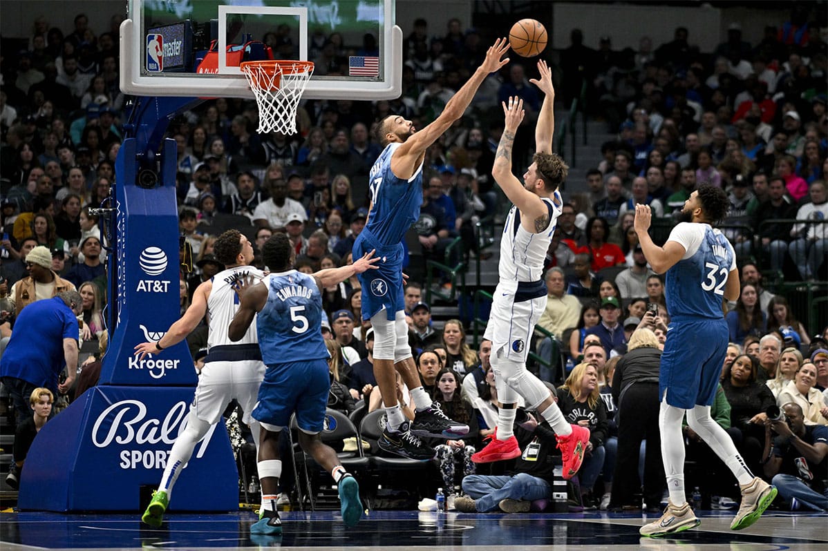 Minnesota Timberwolves center Rudy Gobert (27) blocks a pass by Dallas Mavericks guard Luka Doncic (77) during the first quarter at the American Airlines Center.