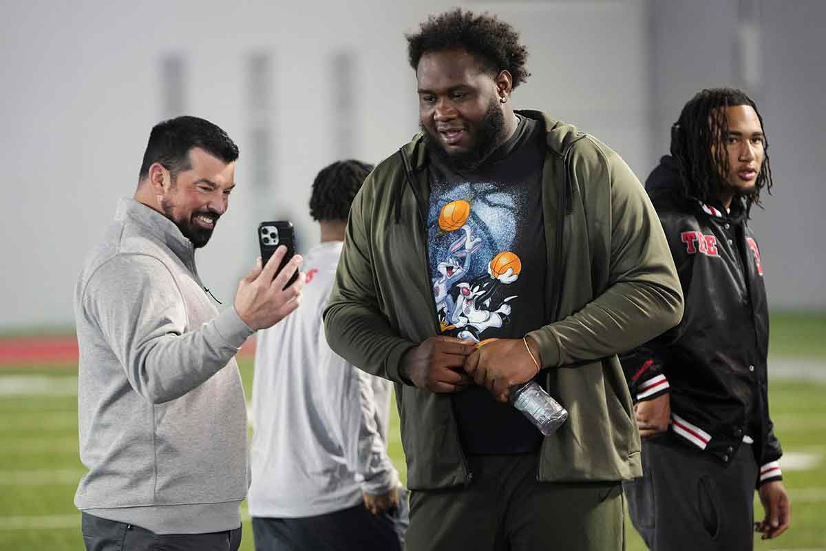USA; Ohio State Buckeyes head coach Ryan Day Facetimes his wife, Christina, to talk to Cleveland Browns offensive lineman Dawand Jones during Pro Day at the Woody Hayes Athletic Center.