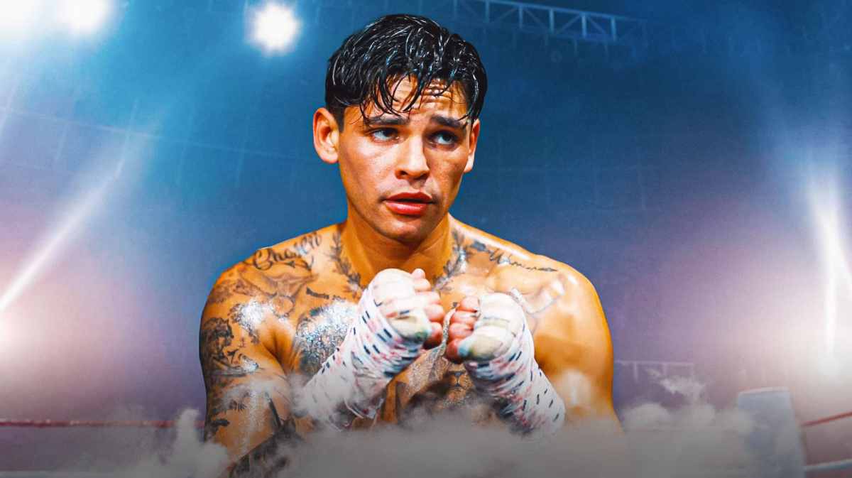 Boxing star Ryan Garcia looks at Devin Haney, PED reporters in background
