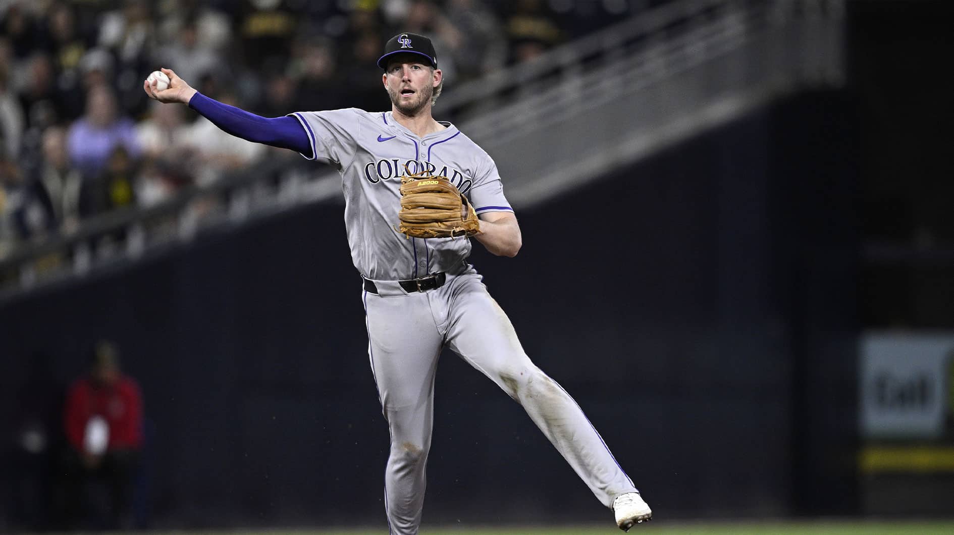 May 13, 2024; San Diego, California, USA; Colorado Rockies third baseman Ryan McMahon (24) throws to first base on a ground out by San Diego Padres right fielder Fernando Tatis Jr. (not pictured) during the seventh inning at Petco Park.