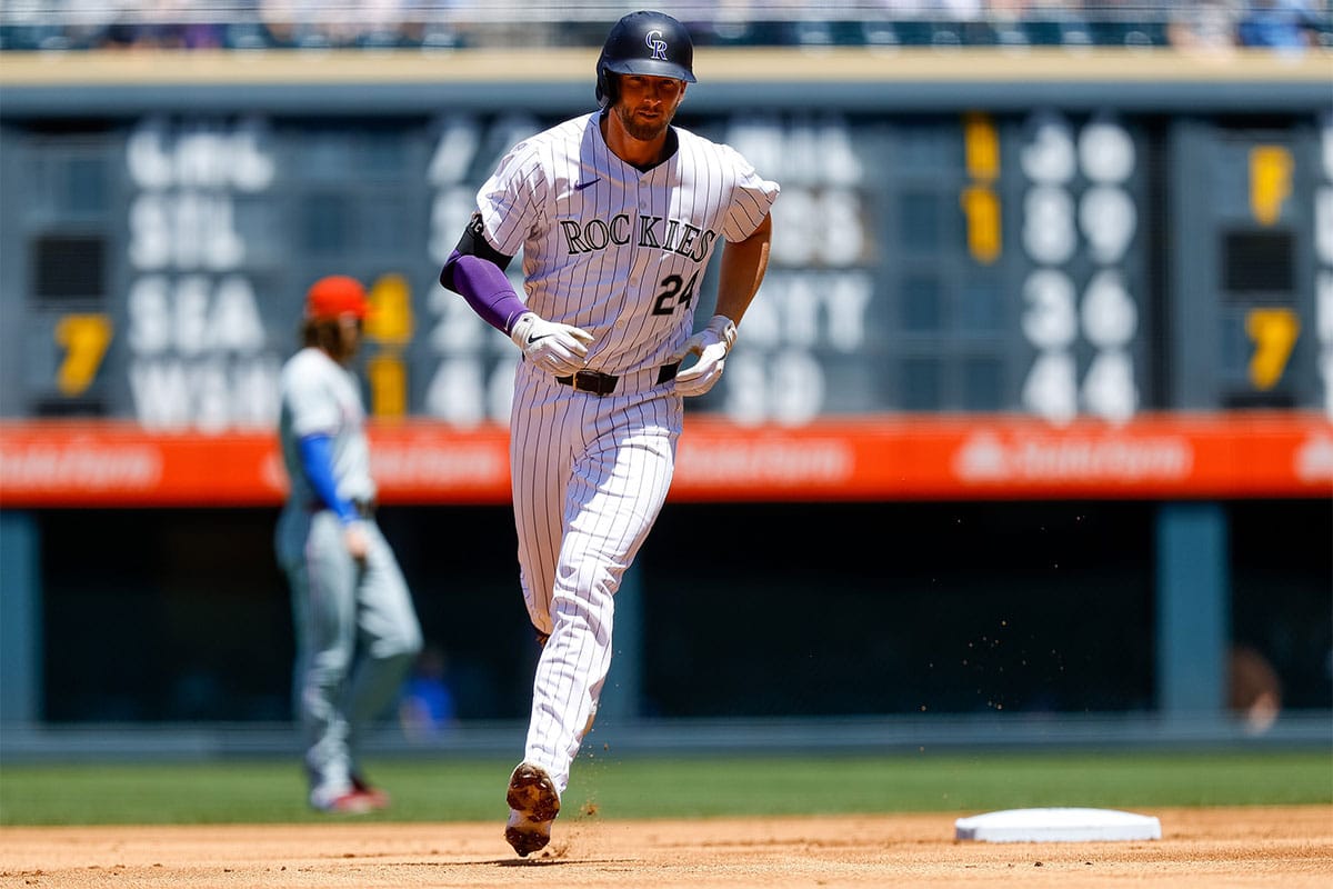 Colorado Rockies third baseman Ryan McMahon (24) rounds the bases on a two run home run in the first inning against the Philadelphia Phillies at Coors Field.