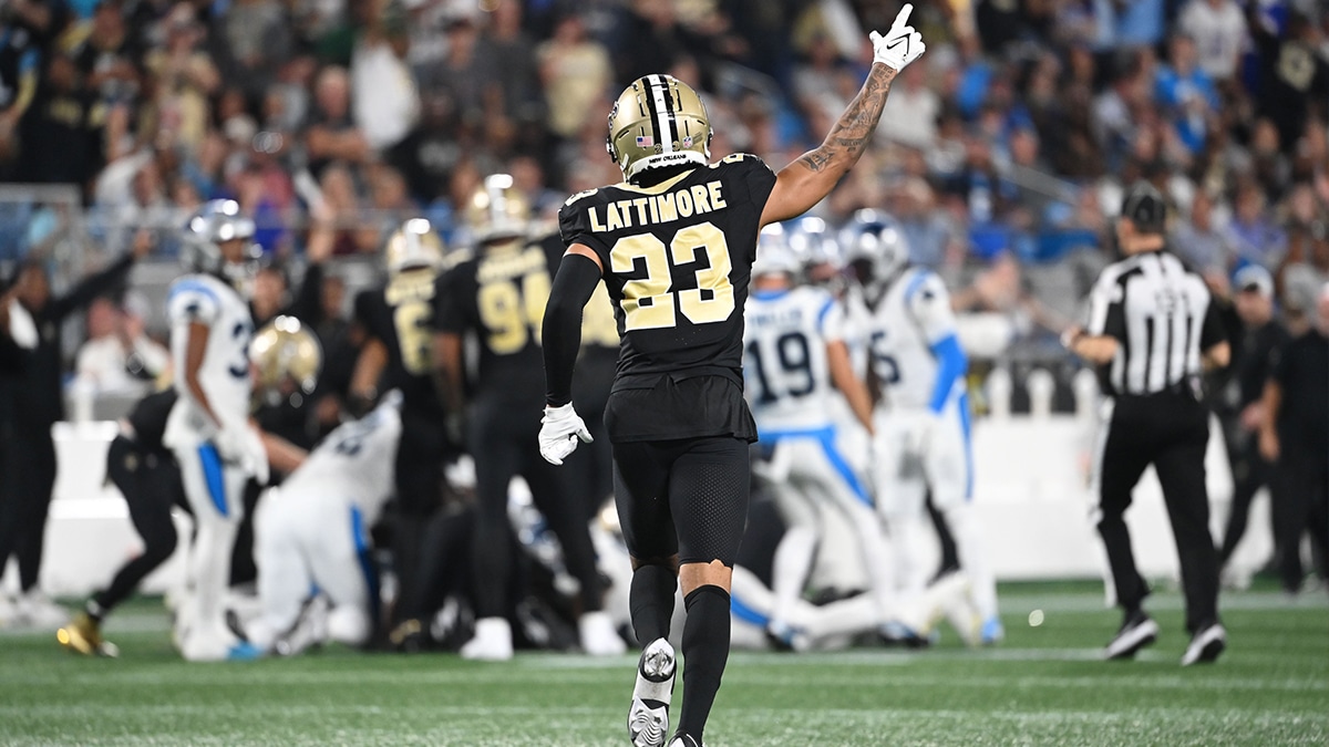 New Orleans Saints cornerback Marshon Lattimore (23) signals a turnover by Carolina Panthers in the second quarter at Bank of America Stadium.