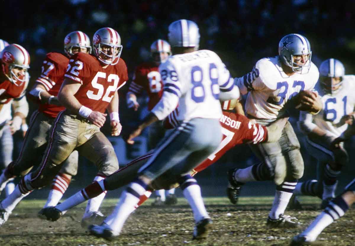 Jan 3, 1971; San Francisco, CA, USA; FILE PHOTO; Dallas Cowboys running back Walt Garrison (32) carries the ball as he is chased by San Francisco 49ers defensive back Jimmy Johnson (37) and linebacker Skip Vanderbundt (52) in the 1970 NFC Championship Game at Kezar Stadium. The Cowboys defeated the 49ers 17-10Mandatory Credit: Darryl Norenberg-USA TODAY Sports