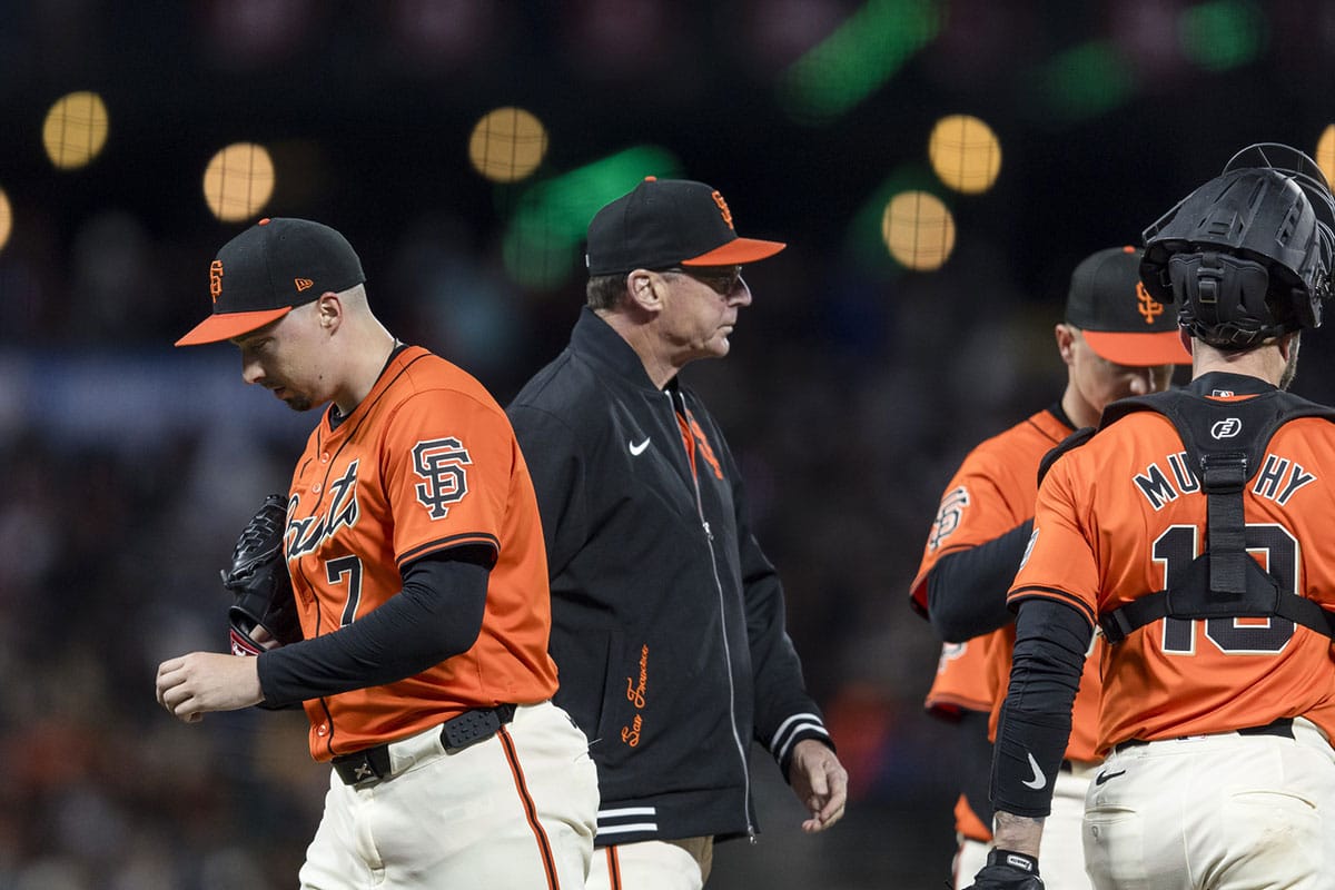 San Francisco Giants third base coach Matt Williams (9) lifts pitcher Blake Snell (7) during the fifth inning of the game against the Arizona Diamondbacks at Oracle Park. 