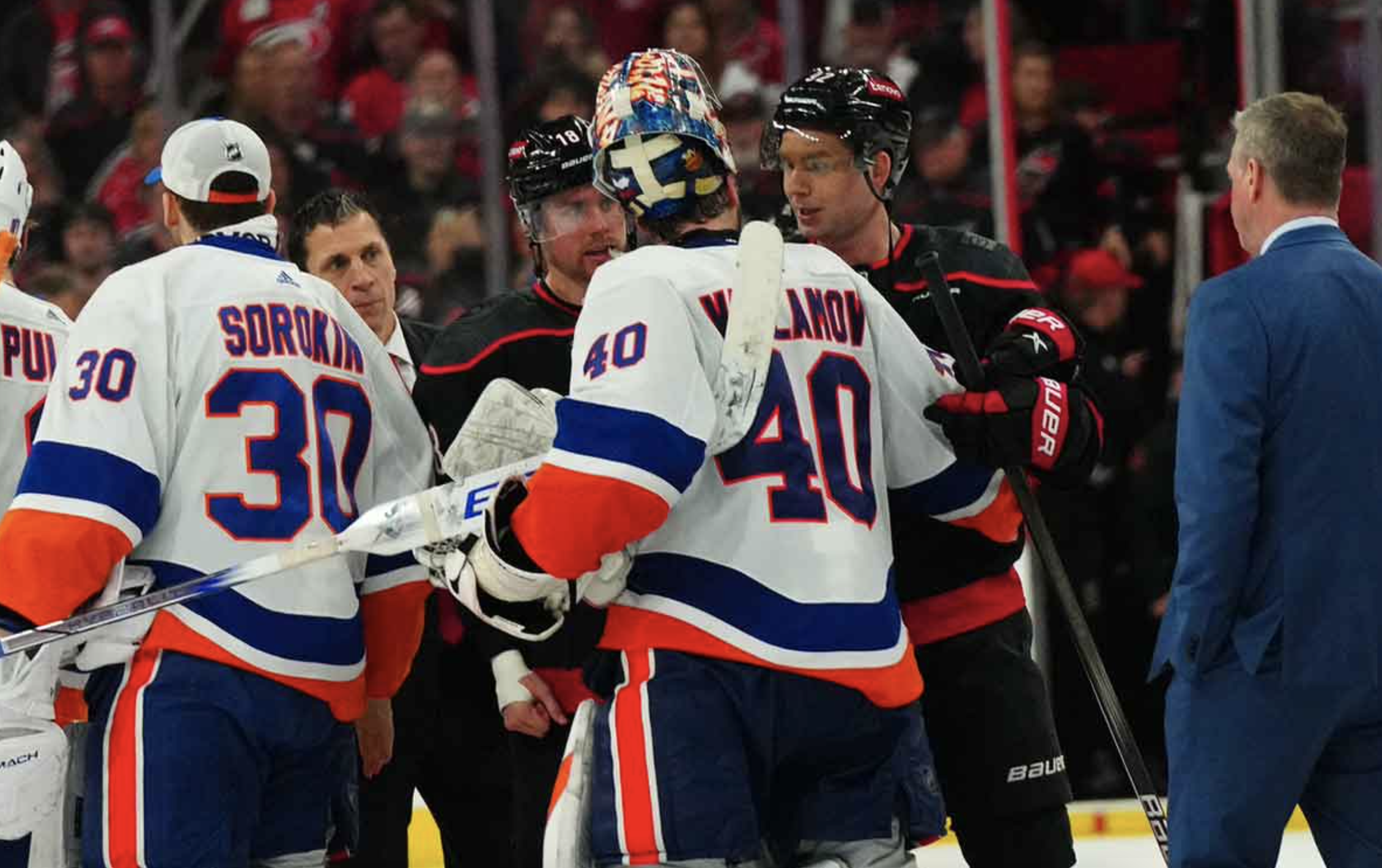 New York Islanders goaltender Semyon Varlamov (40) shakes hands with Carolina Hurricanes center Evgeny Kuznetsov (92) and center Jack Drury (18) after the game in game five of the first round of the 2024 Stanley Cup Playoffs at PNC Arena.