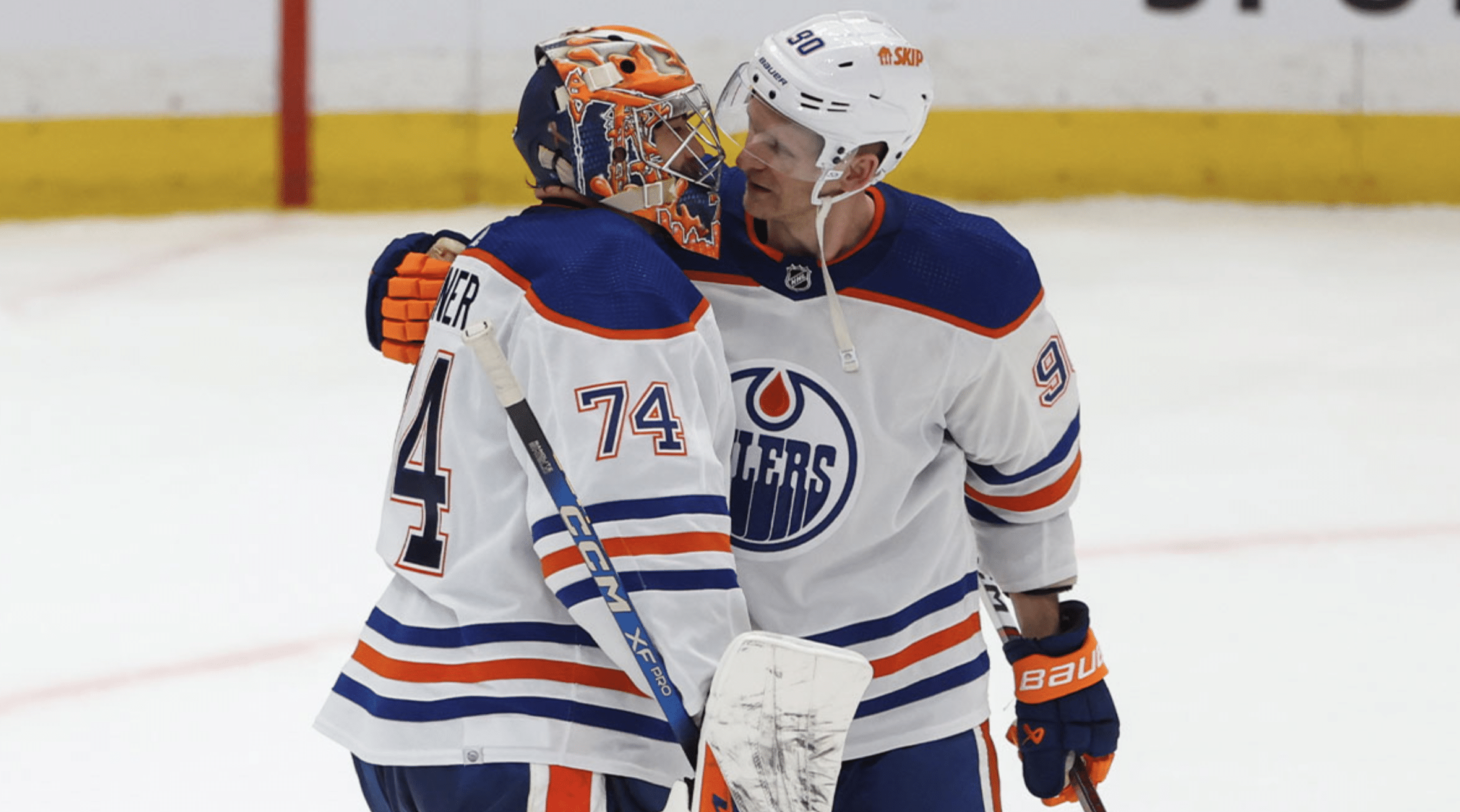 Edmonton Oilers goalie Stuart Skinner (74) and Edmonton Oilers right wing Corey Perry (90) embrace after defeating the Los Angeles Kings in the third period of game four of the first round of the 2024 Stanley Cup Playoffs at Crypto.com Arena.