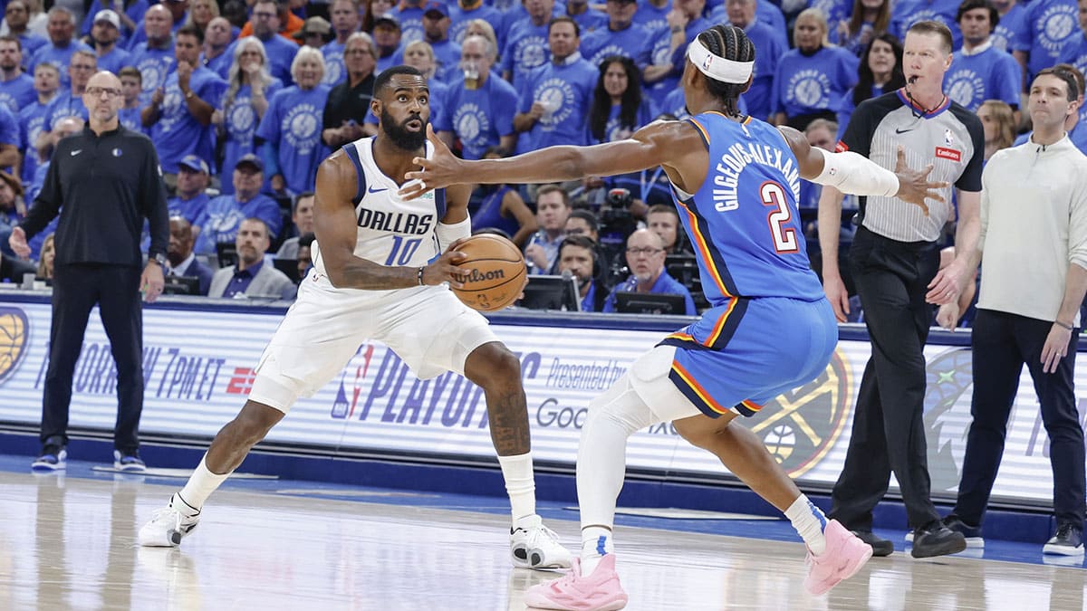 Dallas Mavericks forward Tim Hardaway Jr. (10) is defended by Oklahoma City Thunder guard Shai Gilgeous-Alexander (2) on a drive to the basket during the second half of game two of the second round for the 2024 NBA playoffs at Paycom Center. 