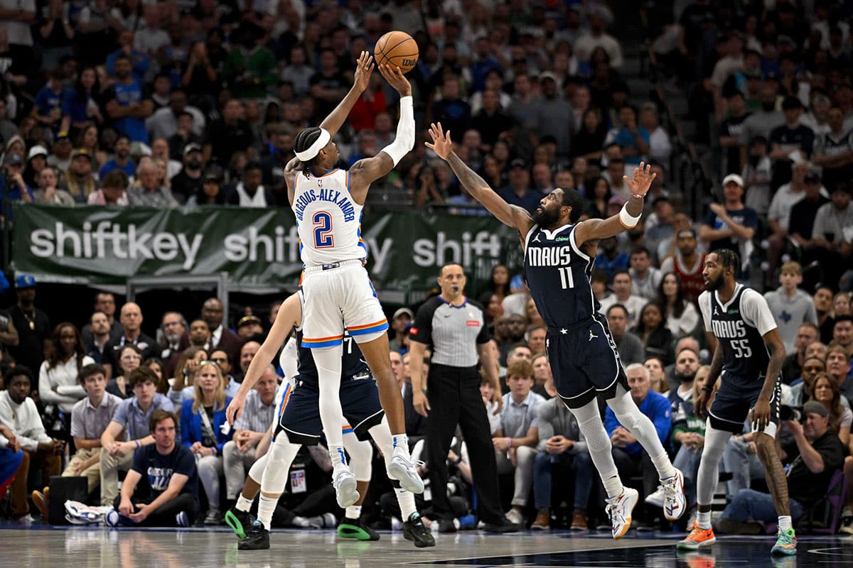 Oklahoma City Thunder guard Shai Gilgeous-Alexander (2) makes a jump shot over Dallas Mavericks guard Kyrie Irving (11) during the second half in game four of the second round for the 2024 NBA playoffs at American Airlines Center.