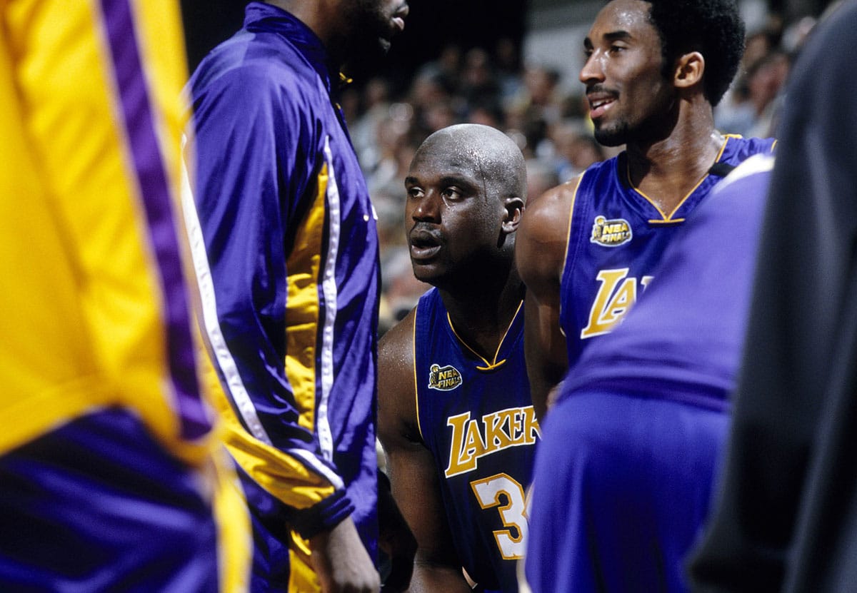 Los Angeles Lakers center Shaquille O'Neal (34) talks to guard Kobe Bryant (8) during a time-out against the Indiana Pacers during the 2000 NBA Finals at Canseco Fieldhouse.