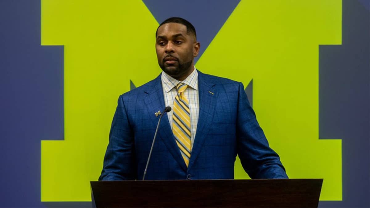 Sherrone Moore, Michigan s new head football coach, speaks in front of family, media and faculty members during a news conference inside the Junge Family Champions Center