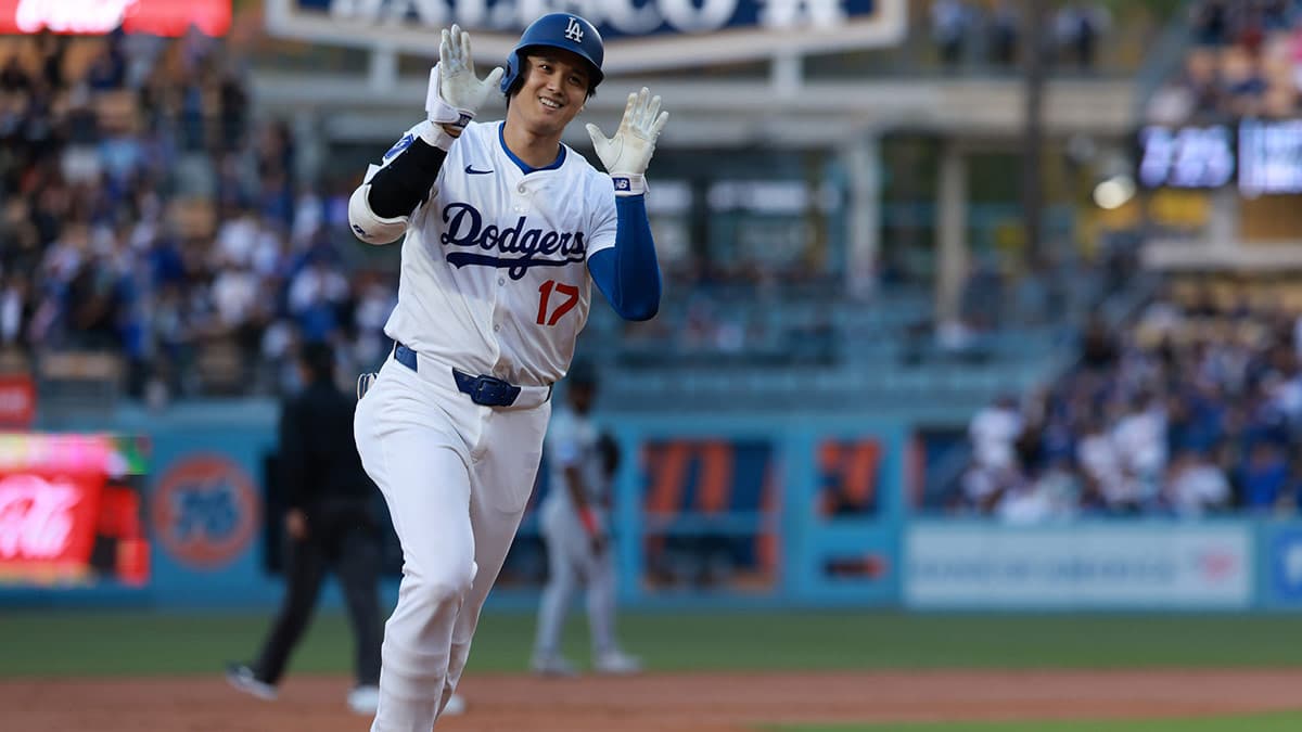 Los Angeles Dodgers designated hitter Shohei Ohtani (17) reacts after hitting a home run during the first inning against the Miami Marlins at Dodger Stadium.