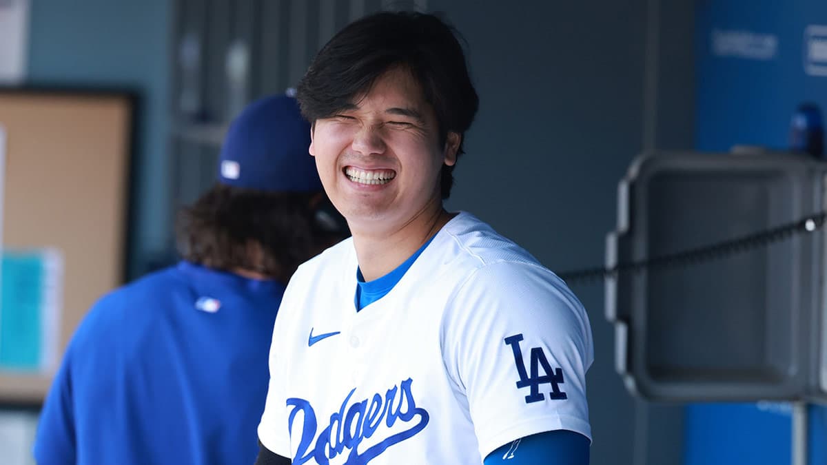 Los Angeles Dodgers designated hitter Shohei Ohtani (17) smiles in the dugout during the MLB game against the Miami Marlins at Dodger Stadium