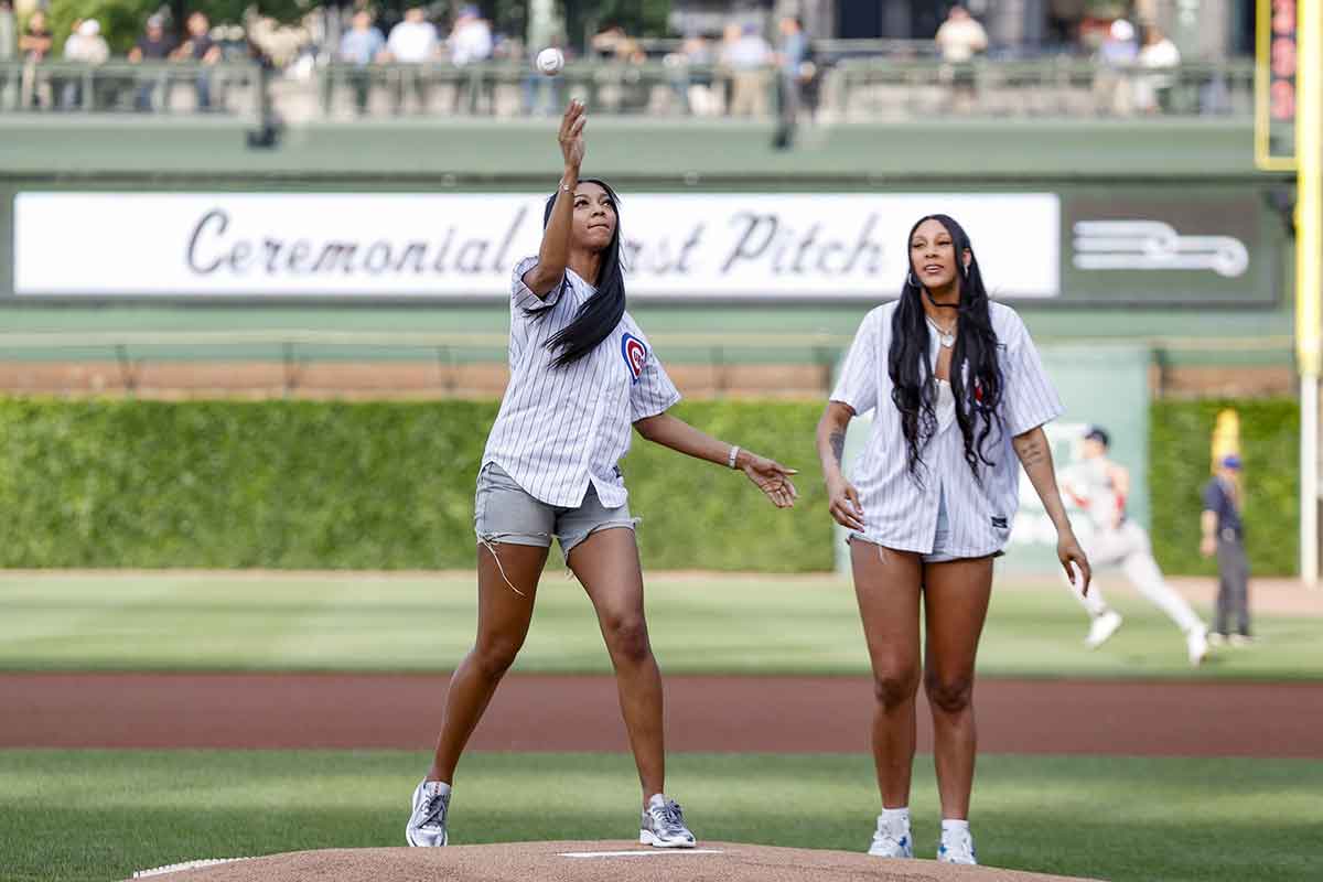 Chicago Sky forward Angel Reese (left) and Chicago Sky center Kamilla Cardoso (right) throw out a ceremonial first pitch