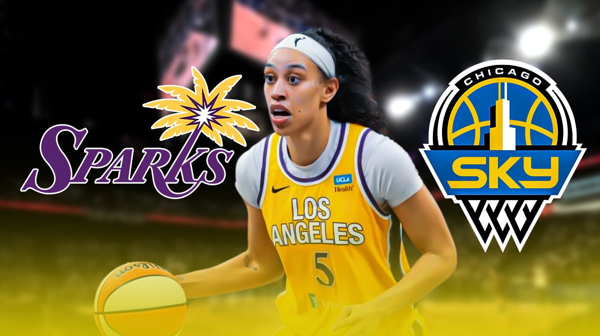 Dearica Hamby with the Sparks and Sky logos in the background