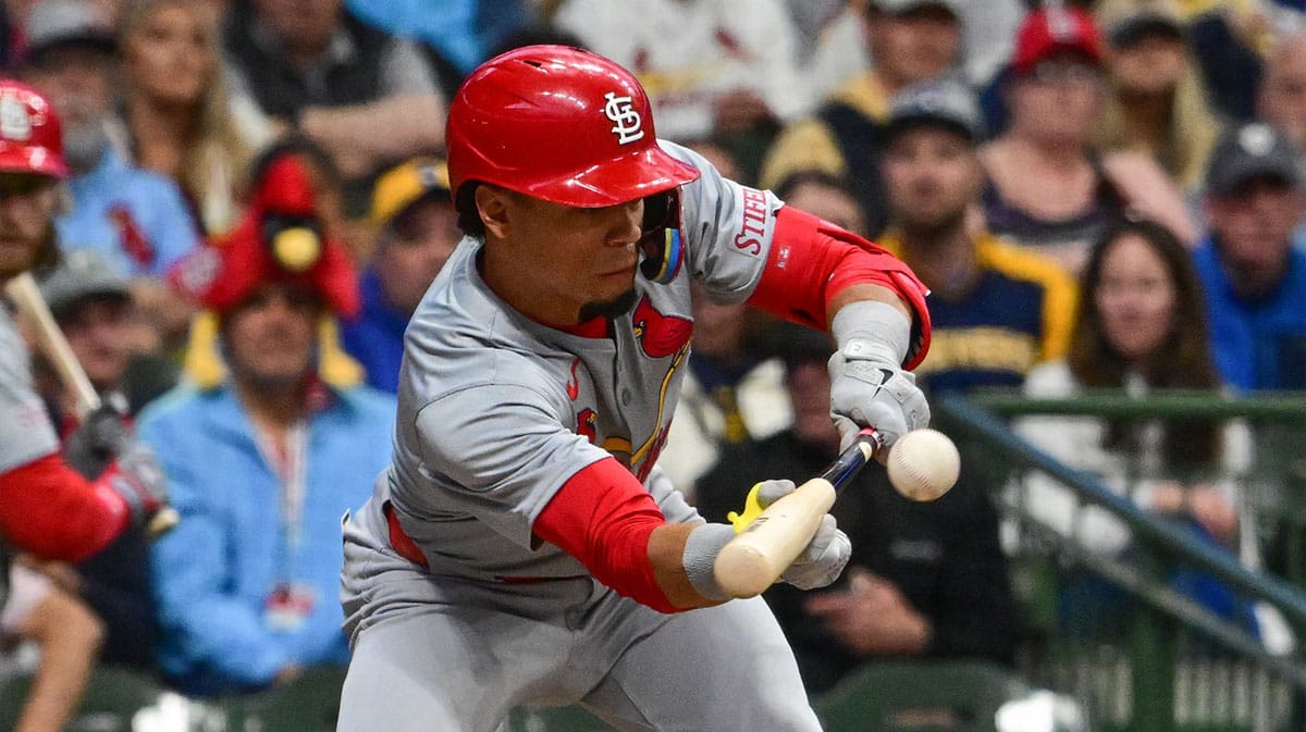 St. Louis Cardinals shortstop Masyn Winn (0) hits a sacrifice bunt against the Milwaukee Brewers in the fifth inning at American Family Field.