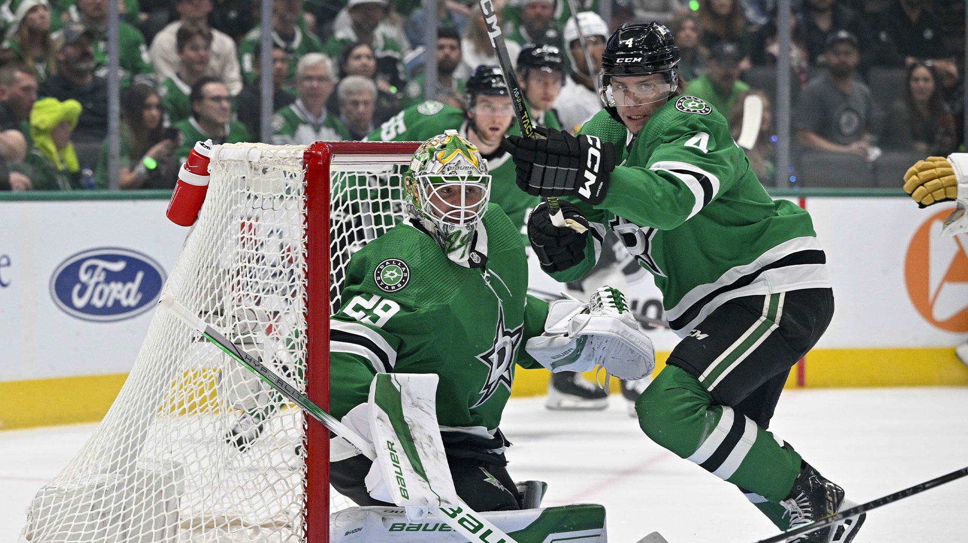 Dallas Stars goaltender Jake Oettinger (29) and defenseman Miro Heiskanen (4) faces the Vegas Golden Knights attack during the first period in game seven of the first round of the 2024 Stanley Cup Playoffs at American Airlines Center.