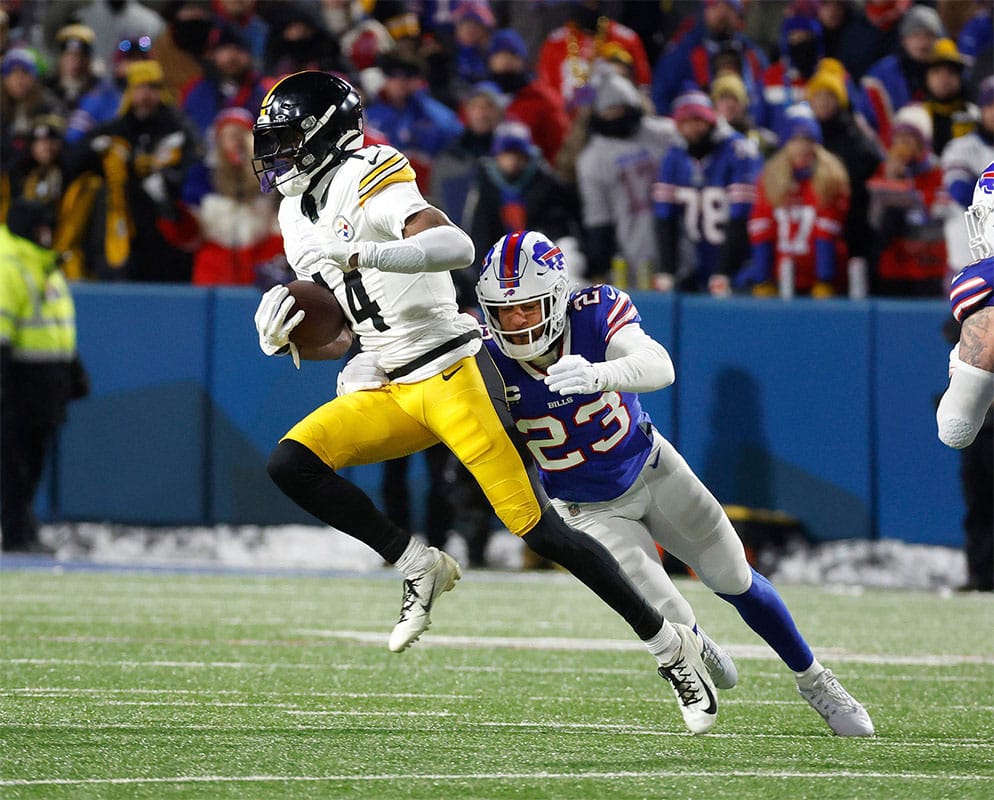 Buffalo Bills safety Micah Hyde (23) makes a tackle on Pittsburgh Steelers wide receiver George Pickens (14) after a catch.