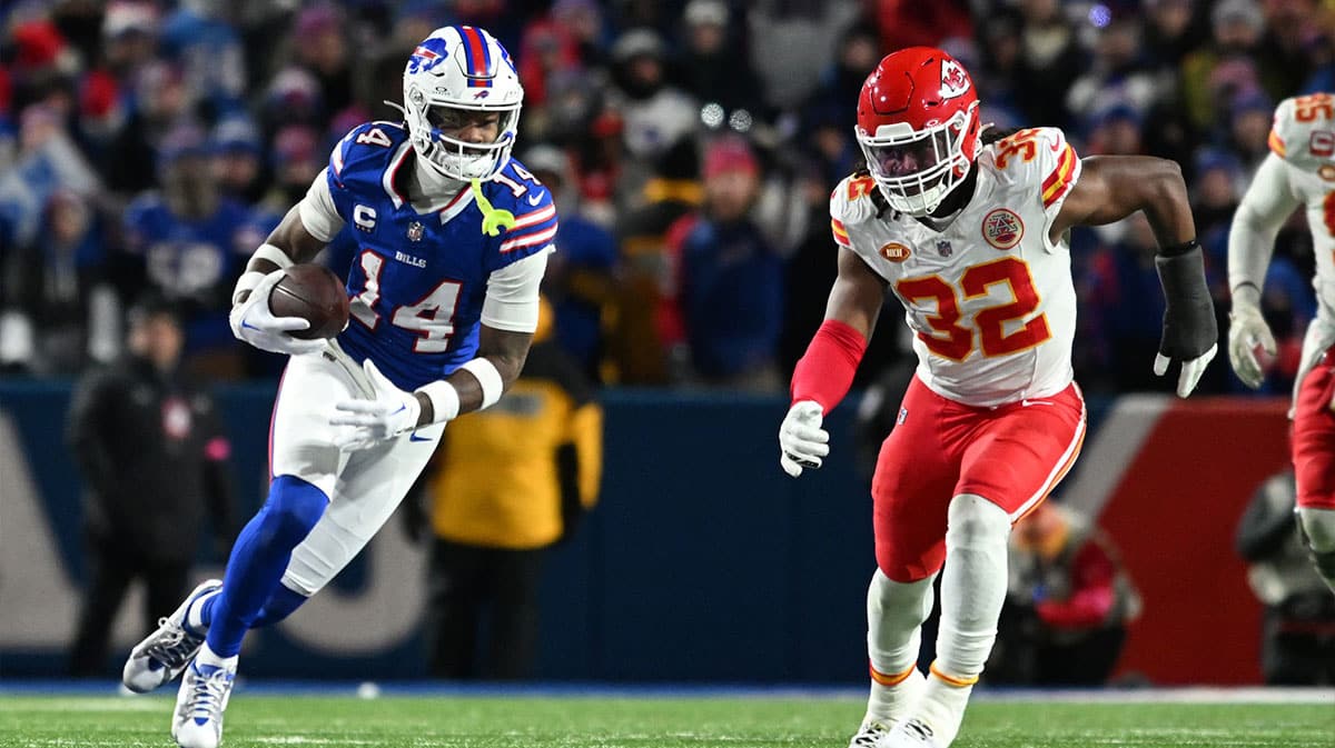 Buffalo Bills wide receiver Stefon Diggs (14) makes a catch against Kansas City Chiefs linebacker Nick Bolton (32) in the first half of the 2024 AFC divisional round game at Highmark Stadium.