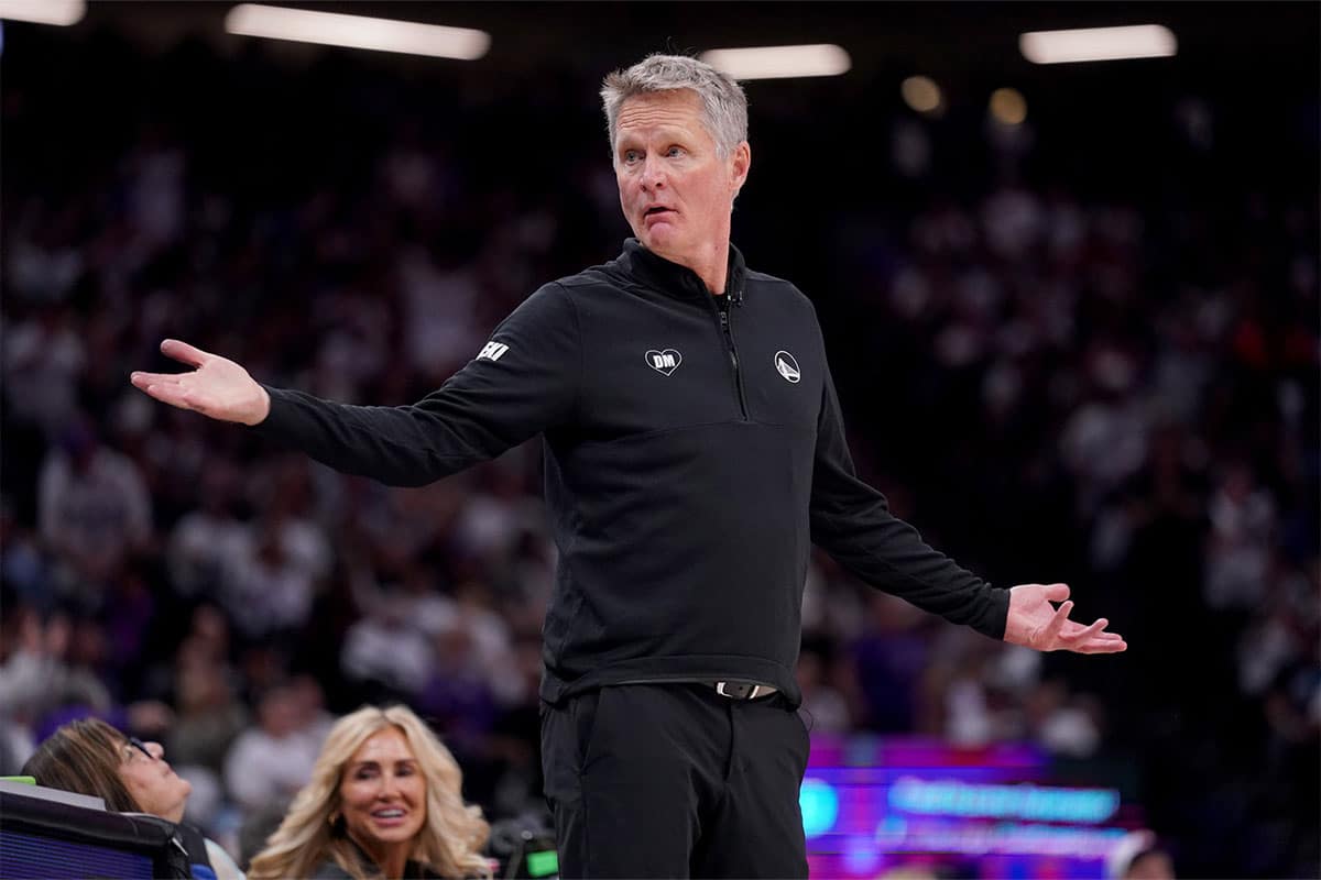 Golden State Warriors head coach Steve Kerr looks towards the team bench after a foul call during action against the Sacramento Kings in the fourth quarter during a play-in game of the 2024 NBA playoffs at the Golden 1 Center.