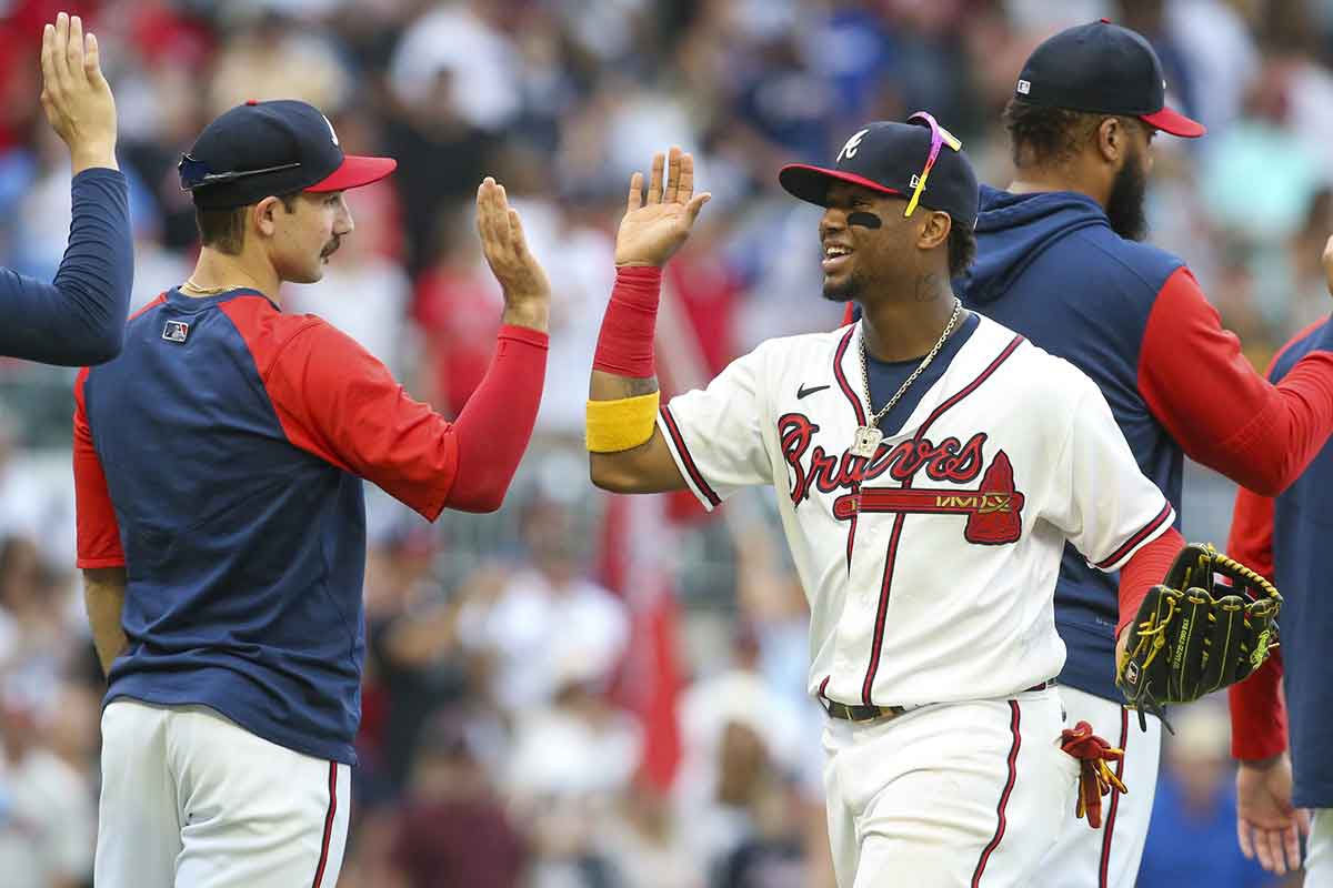 Atlanta Braves starting pitcher Spencer Strider (65) and right fielder Ronald Acuna Jr. (13) celebrate after a victory against the Pittsburgh Pirates at Truist Park