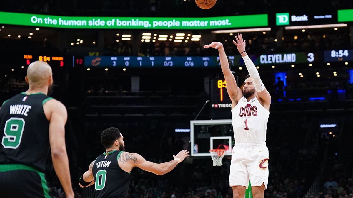 Cleveland Cavaliers guard Max Strus (1) shoots against Boston Celtics forward Jayson Tatum (0) in the first quarter during game five of the second round for the 2024 NBA playoffs at TD Garden.