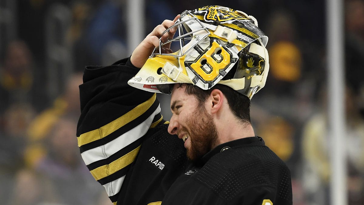 Boston Bruins goaltender Jeremy Swayman (1) slips on his mask during the second period in game four of the second round of the 2024 Stanley Cup Playoffs against the Florida Panthers at TD Garden.