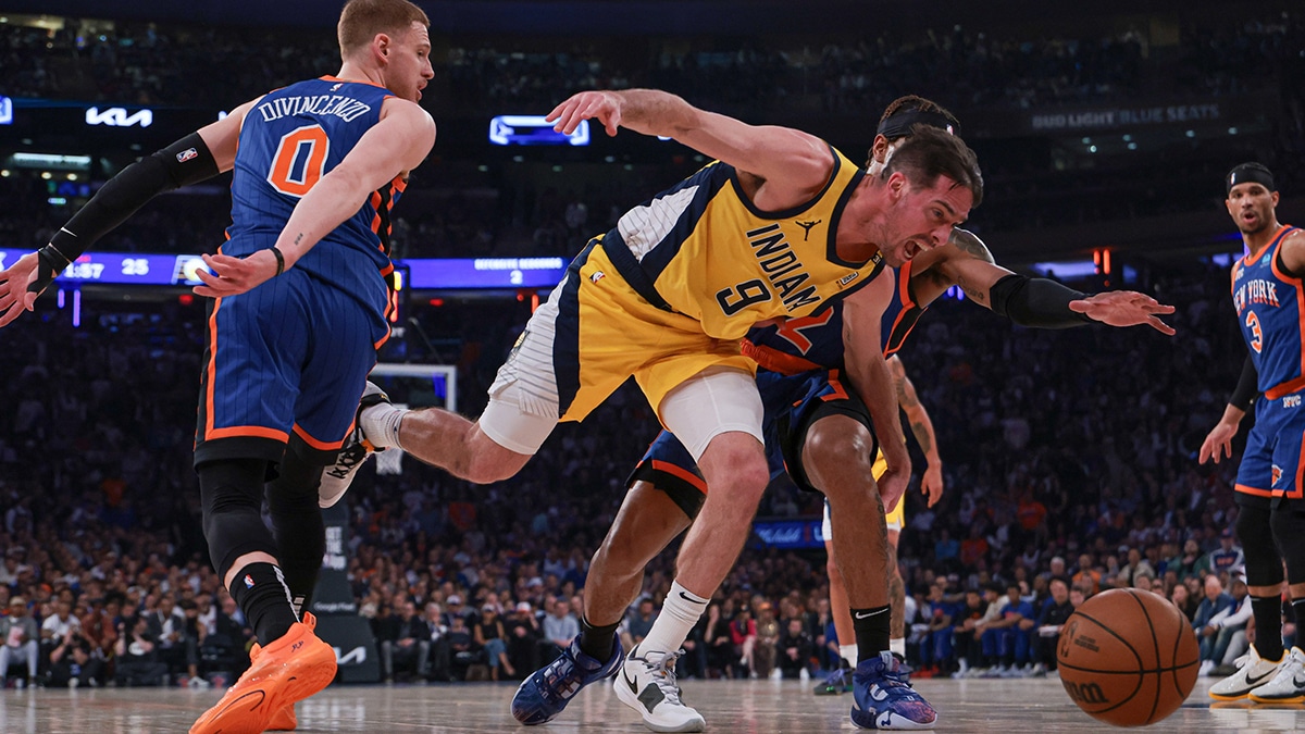Indiana Pacers guard T.J. McConnell (9) battles New York Knicks guard Miles McBride (2) and guard Donte DiVincenzo (0) for the ball during the first half during game five of the second round for the 2024 NBA playoffs at Madison Square Garden.