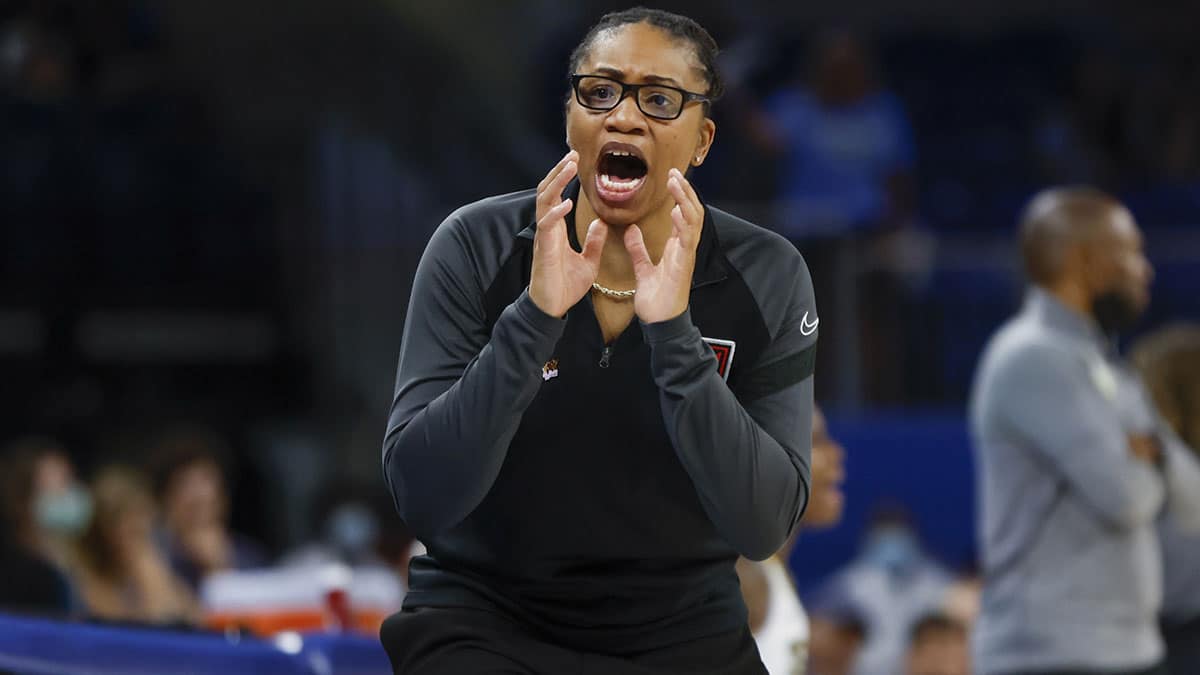 Atlanta Dream head coach Tanisha Wright yells to the team during the first half of a WNBA game against the Chicago Sky at Wintrust Arena.