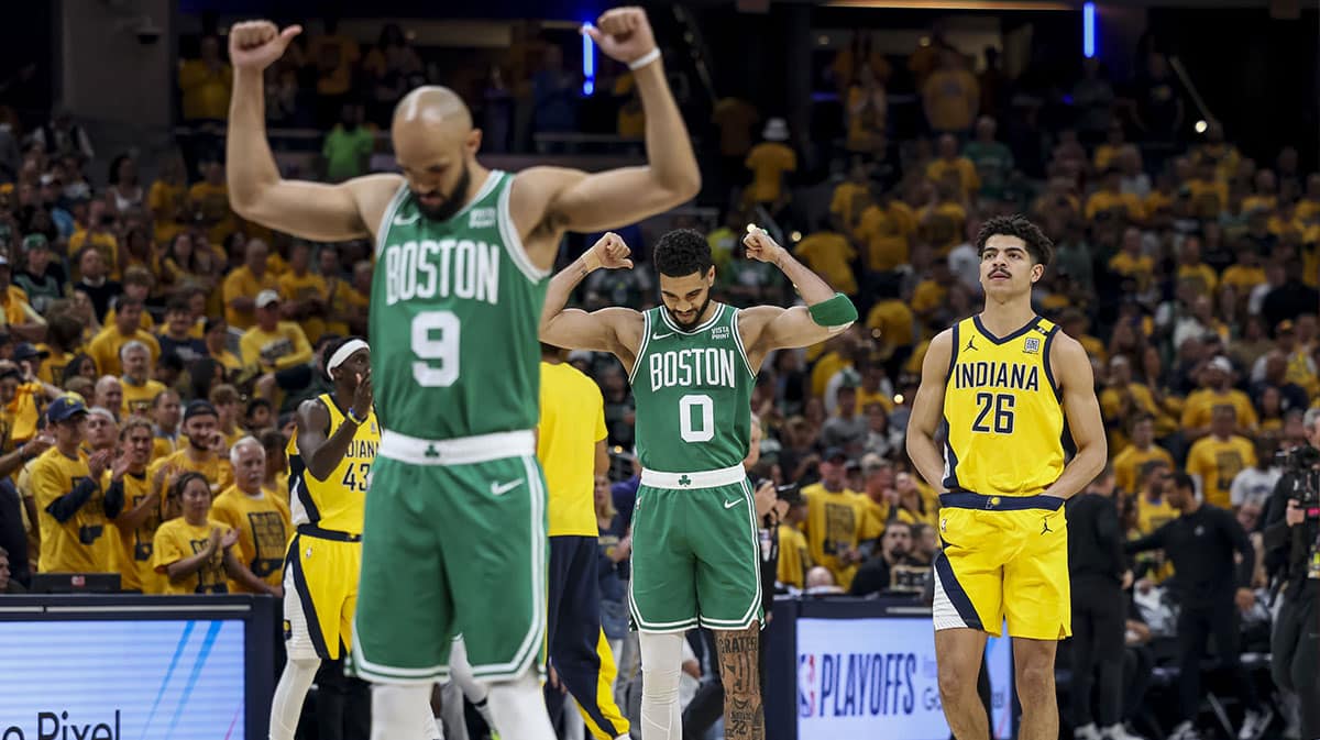 Boston Celtics guard Derrick White (9) and Boston Celtics forward Jayson Tatum (0) react to a play during the first quarter during game four of the eastern conference finals for the 2024 NBA playoffs at Gainbridge Fieldhouse.