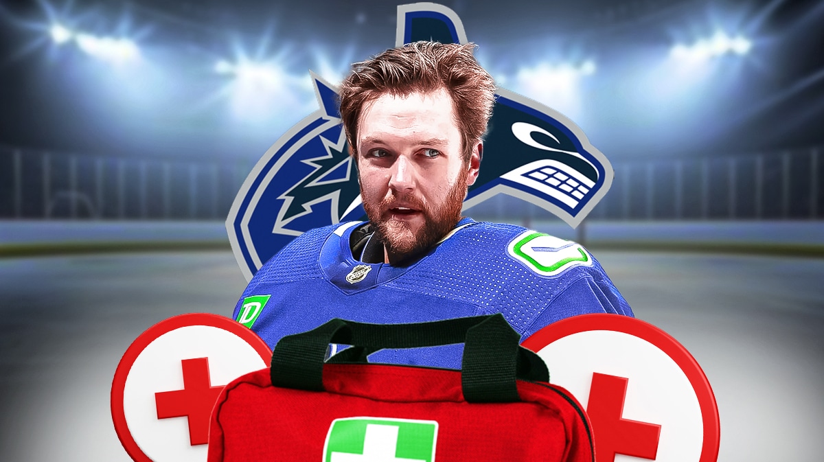 Thatcher Demko in middle of image looking hopeful, first aid kit, Vancouver Canucks logo, hockey rink in background