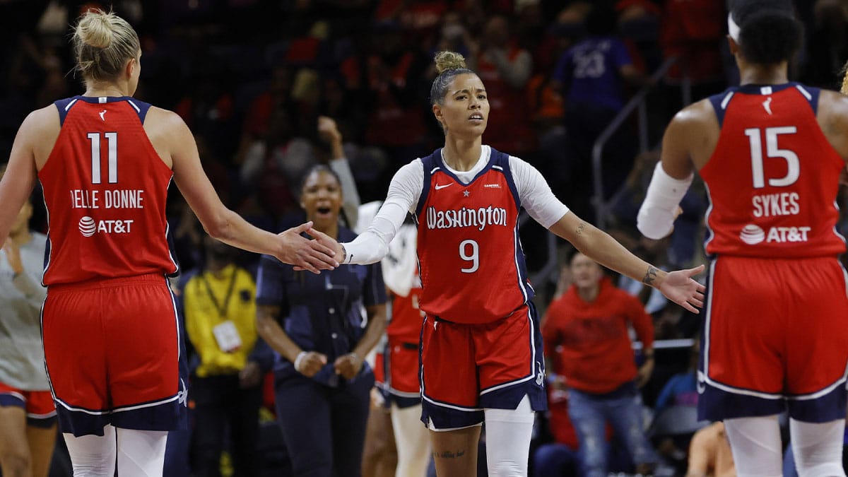 Washington Mystics guard Natasha Cloud (9) celebrates with Mystics forward Elena Delle Donne (11) and Mystics guard Brittney Sykes (15) in the fourth quarter at Entertainment & Sports Arena.