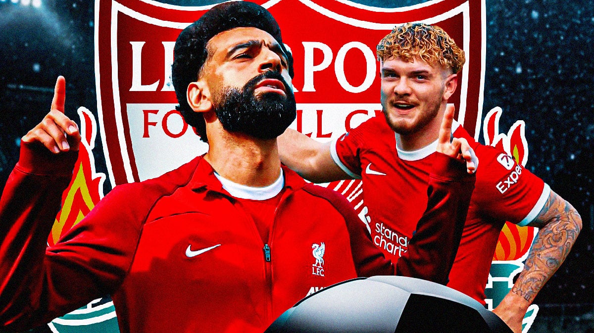 Mohamed Salah, Harvey Elliot celebrating in front of the Liverpool logo