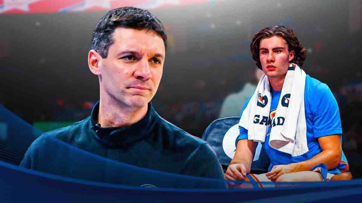 Oklahoma City Thunder guard Josh Giddey sitting on the bench. Standing up beside him is Thunder coach Mark Daigneault.