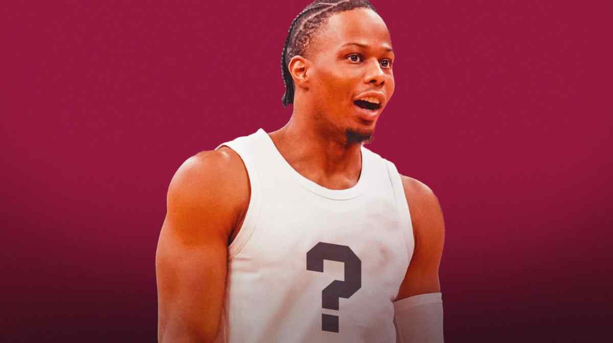 Isaac Okoro in a blank jersey with a question mark on it, with a Cavs-colored background.