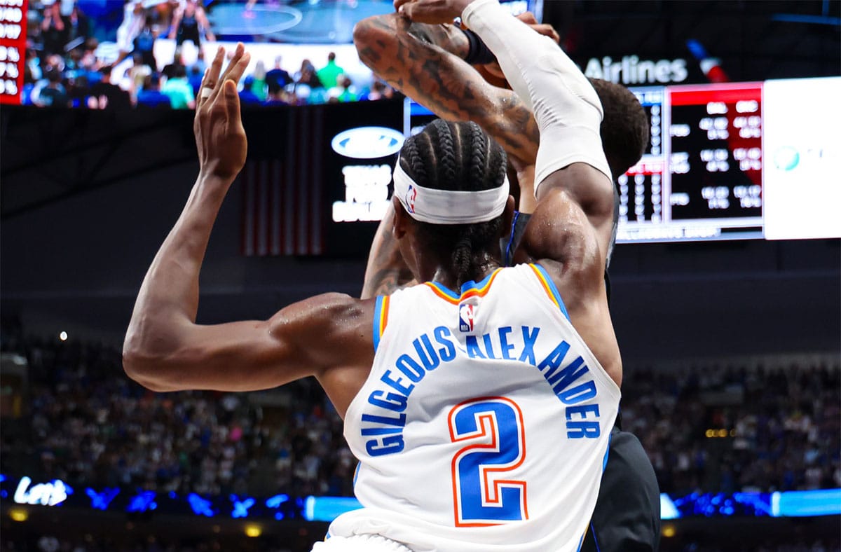 Oklahoma City Thunder guard Shai Gilgeous-Alexander (2) fouls Dallas Mavericks forward P.J. Washington (25) during the fourth quarter during the second half in game six of the second round of the 2024 NBA playoffs at American Airlines Center. 